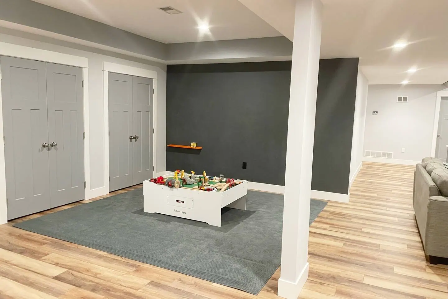 Kids play corner with a low table and a colorful chalkboard wall