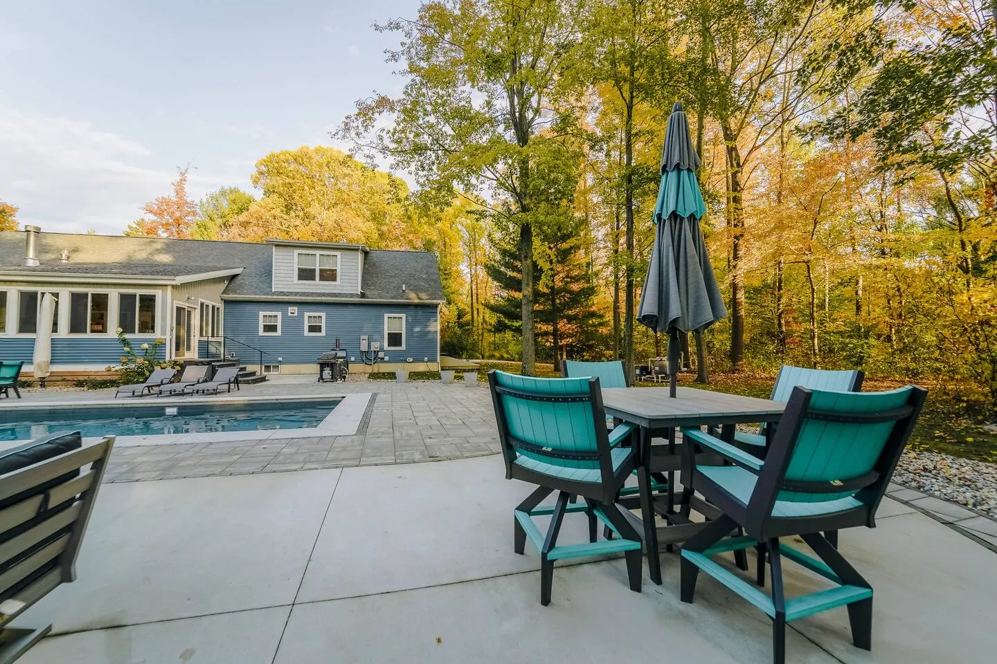 Outdoor dining table on the patio overlooking the pool