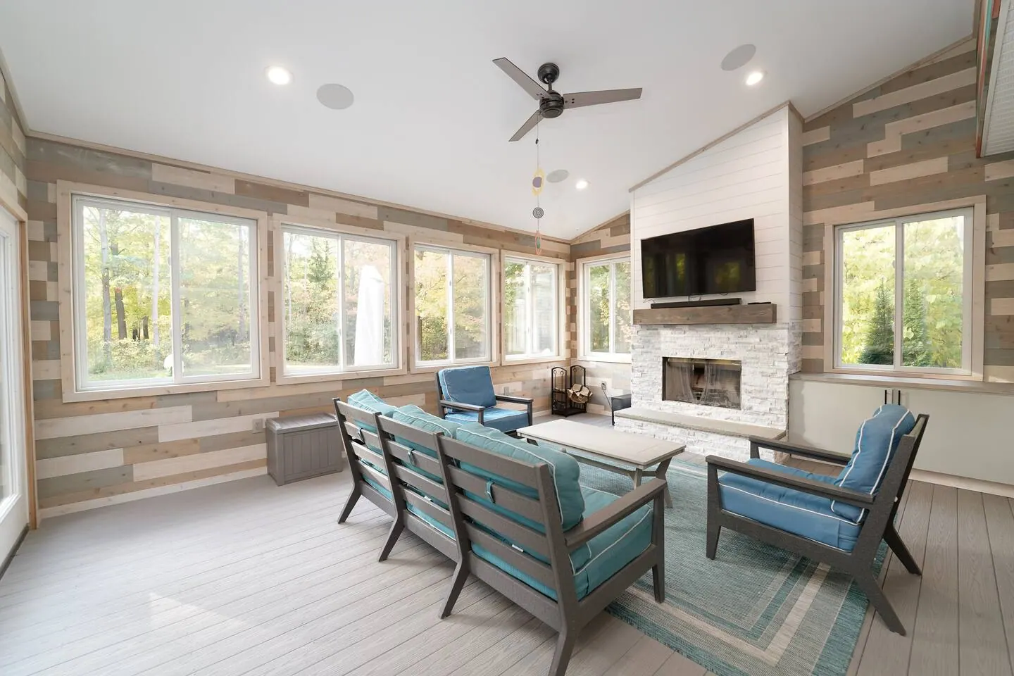 Dining table set between the kitchen and the living fireplace